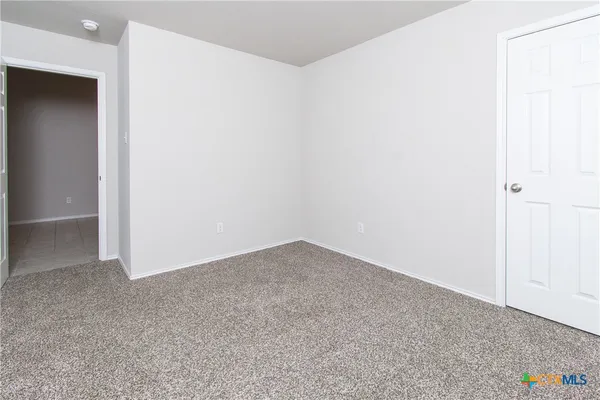 an empty room with an entryway