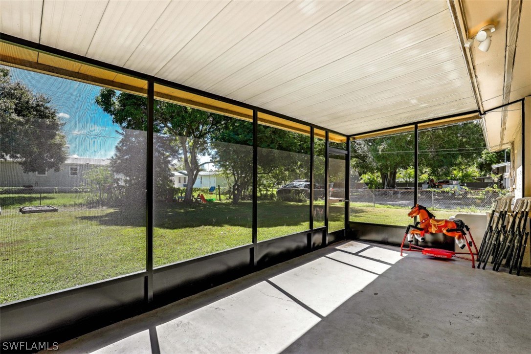 2310 Caladium Road Fort Myers, FL 33905 - Photo 11 of 31 a view of a floor to ceiling window and an outdoor space