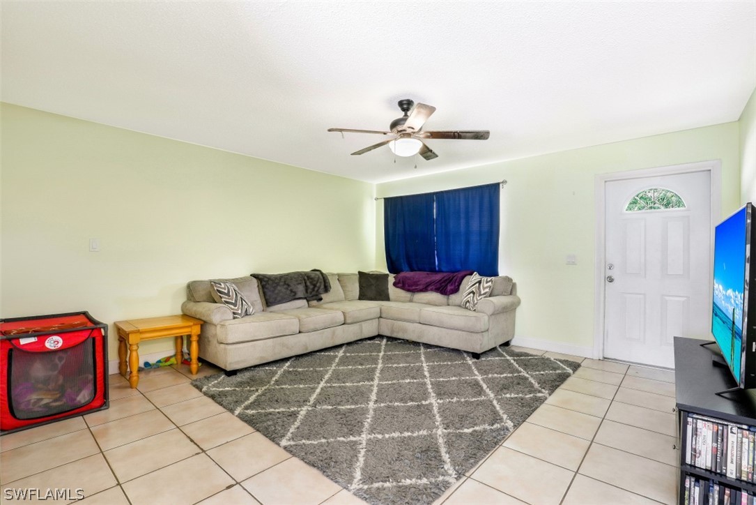 2310 Caladium Road Fort Myers, FL 33905 - Photo 13 of 31 a living room with furniture and a potted plant