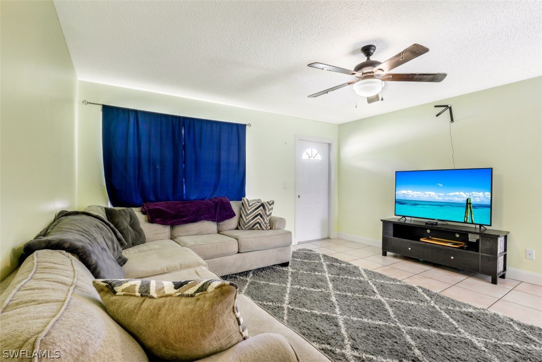 2310 Caladium Road Fort Myers, FL 33905 - Photo 14 of 31 a living room with furniture and a flat screen tv