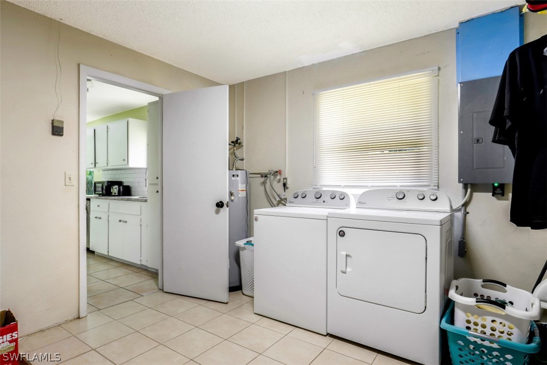 2310 Caladium Road Fort Myers, FL 33905 - Photo 23 of 31 a view of washer and dryer with bathroom