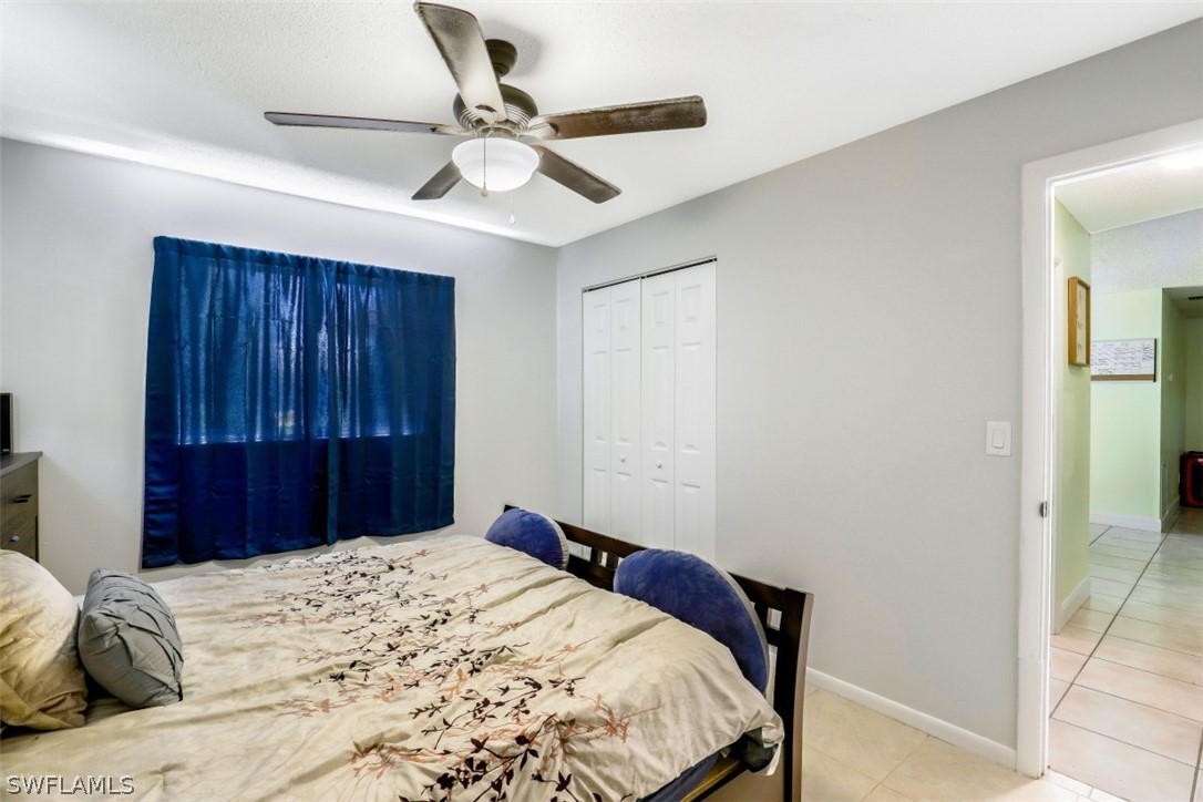 2310 Caladium Road Fort Myers, FL 33905 - Photo 25 of 31 a bedroom with a bed and a dresser
