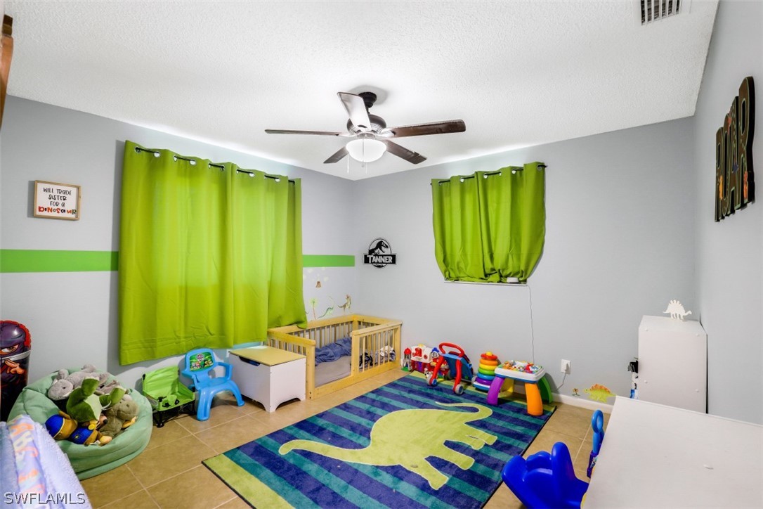 2310 Caladium Road Fort Myers, FL 33905 - Photo 28 of 31 a living room with furniture and a window