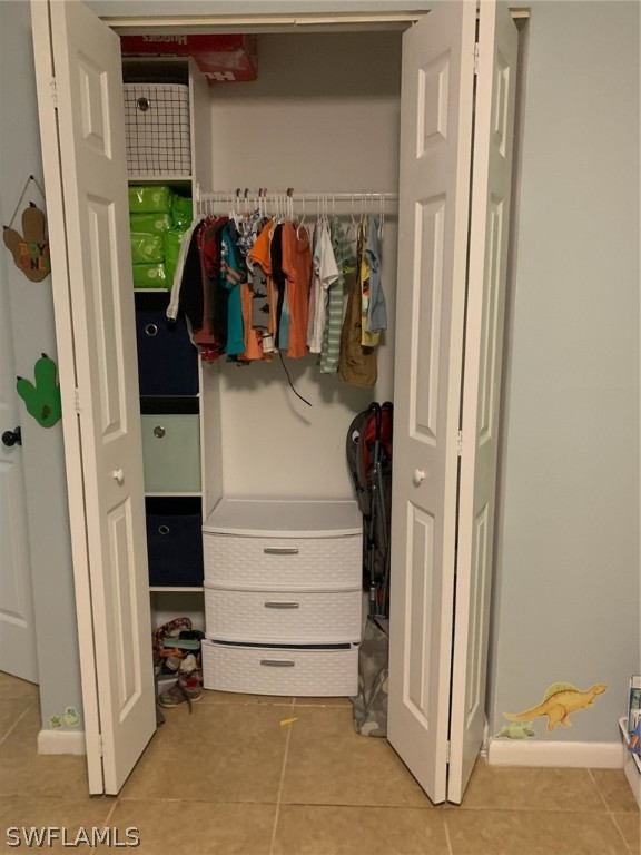 2310 Caladium Road Fort Myers, FL 33905 - Photo 29 of 31 a view of walk in closet with clothes and shoes