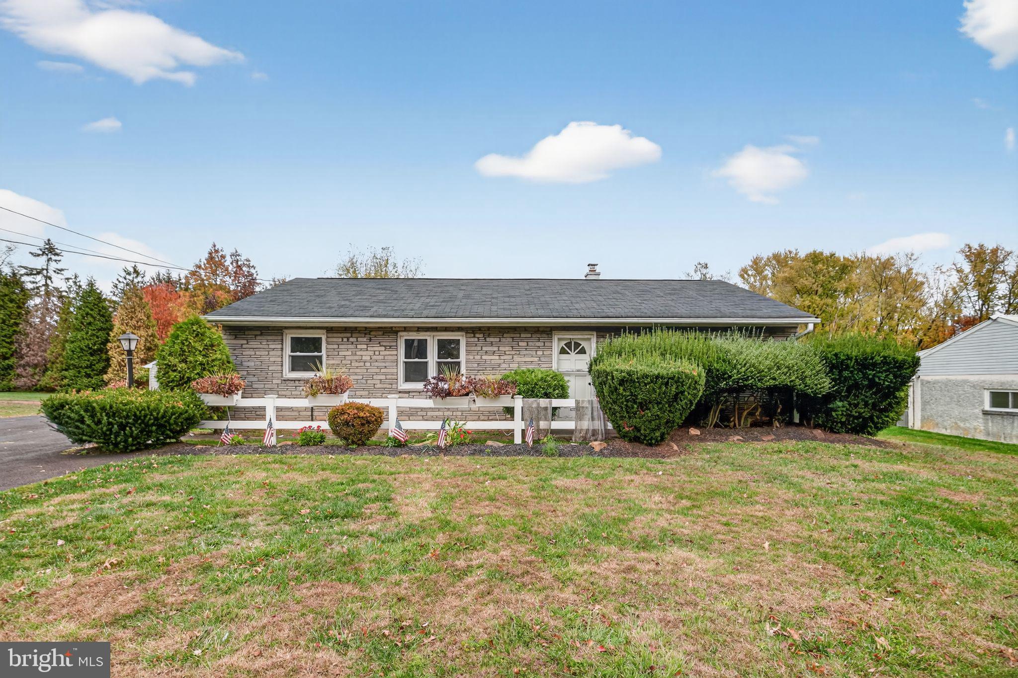 a view of a house with backyard porch and sitting area