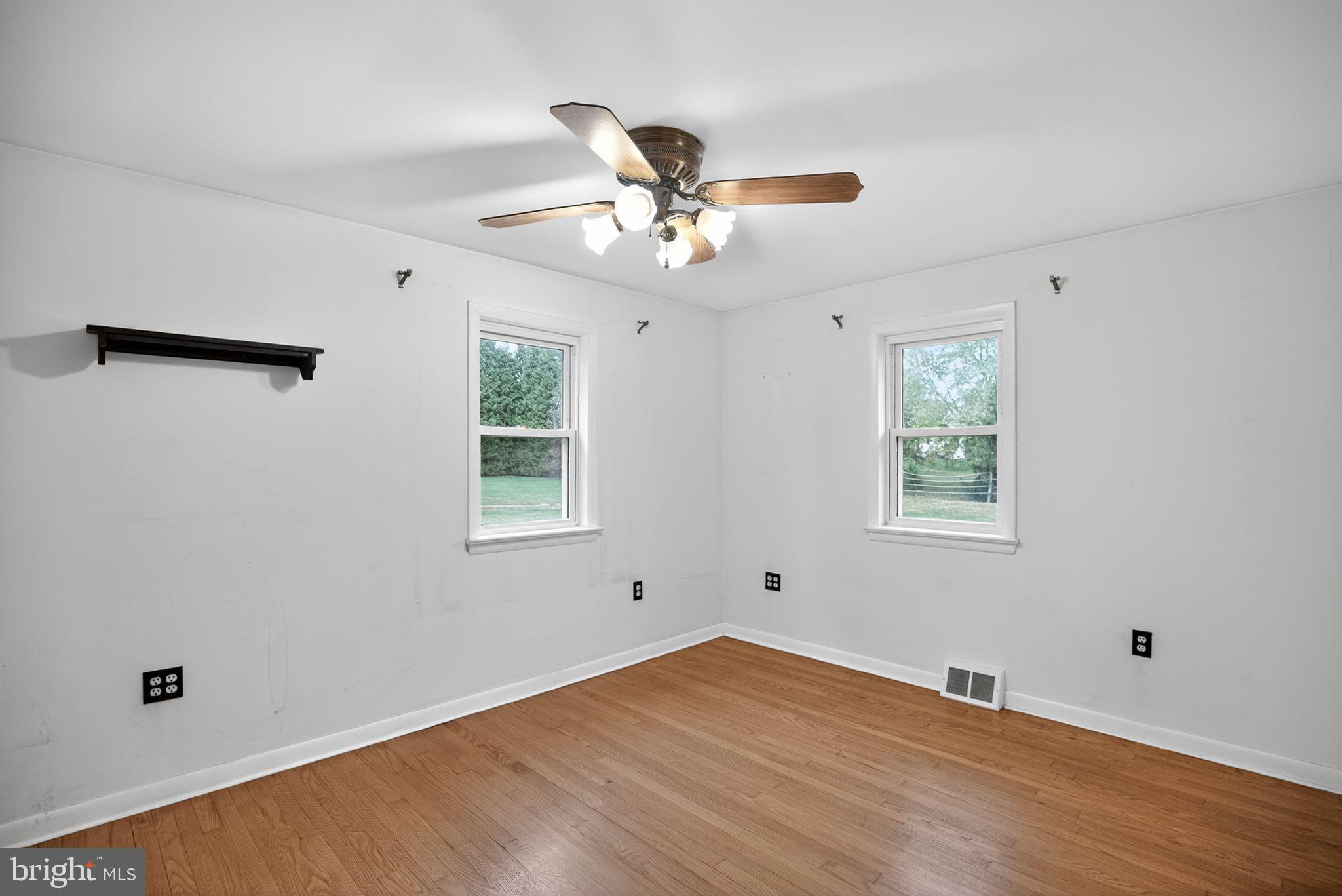 420 North Lewis Road Royersford, PA 19468 - Photo 17 of 28 a view of an empty room with window and wooden floor