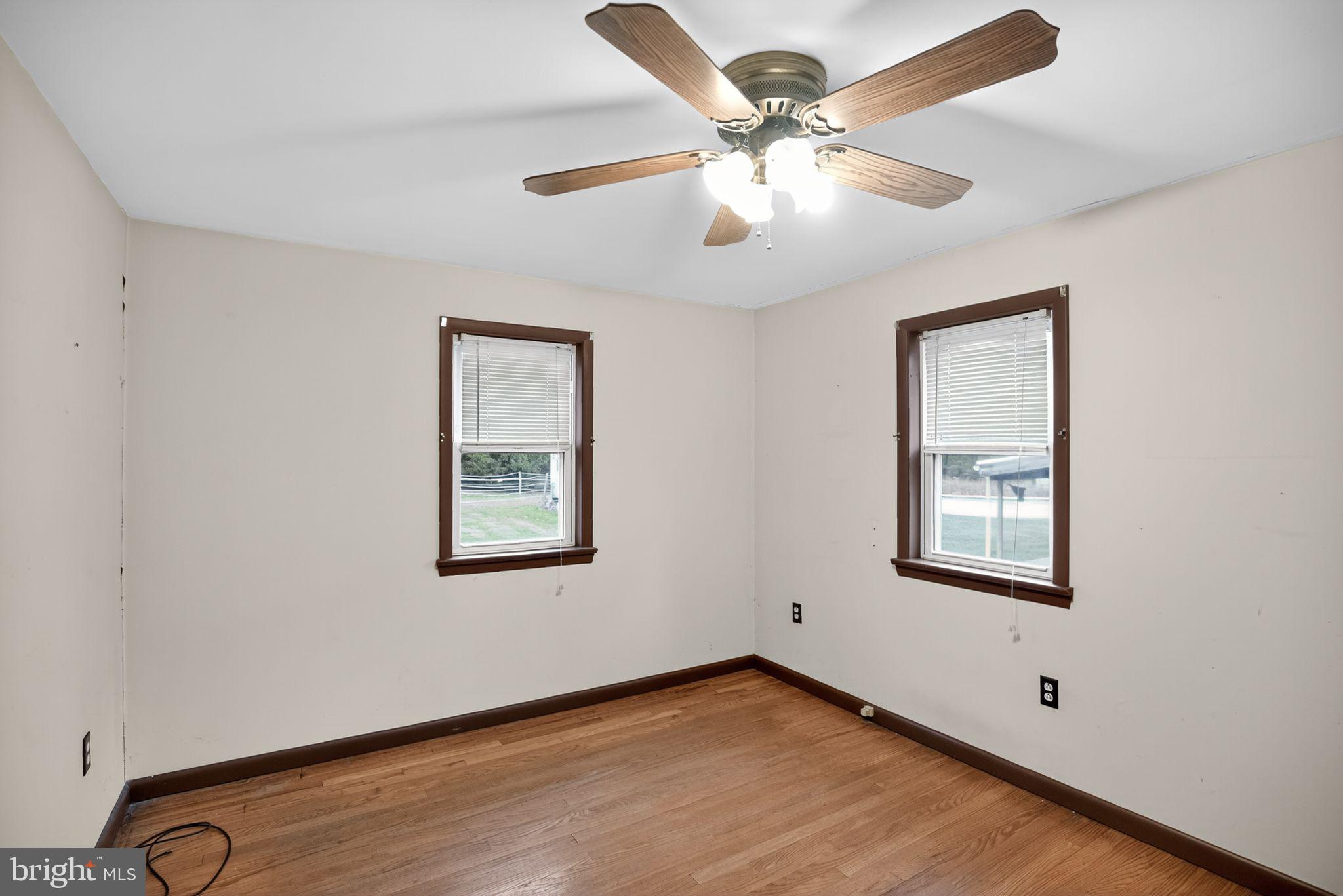 420 North Lewis Road Royersford, PA 19468 - Photo 18 of 28 a view of an empty room with window and wooden floor