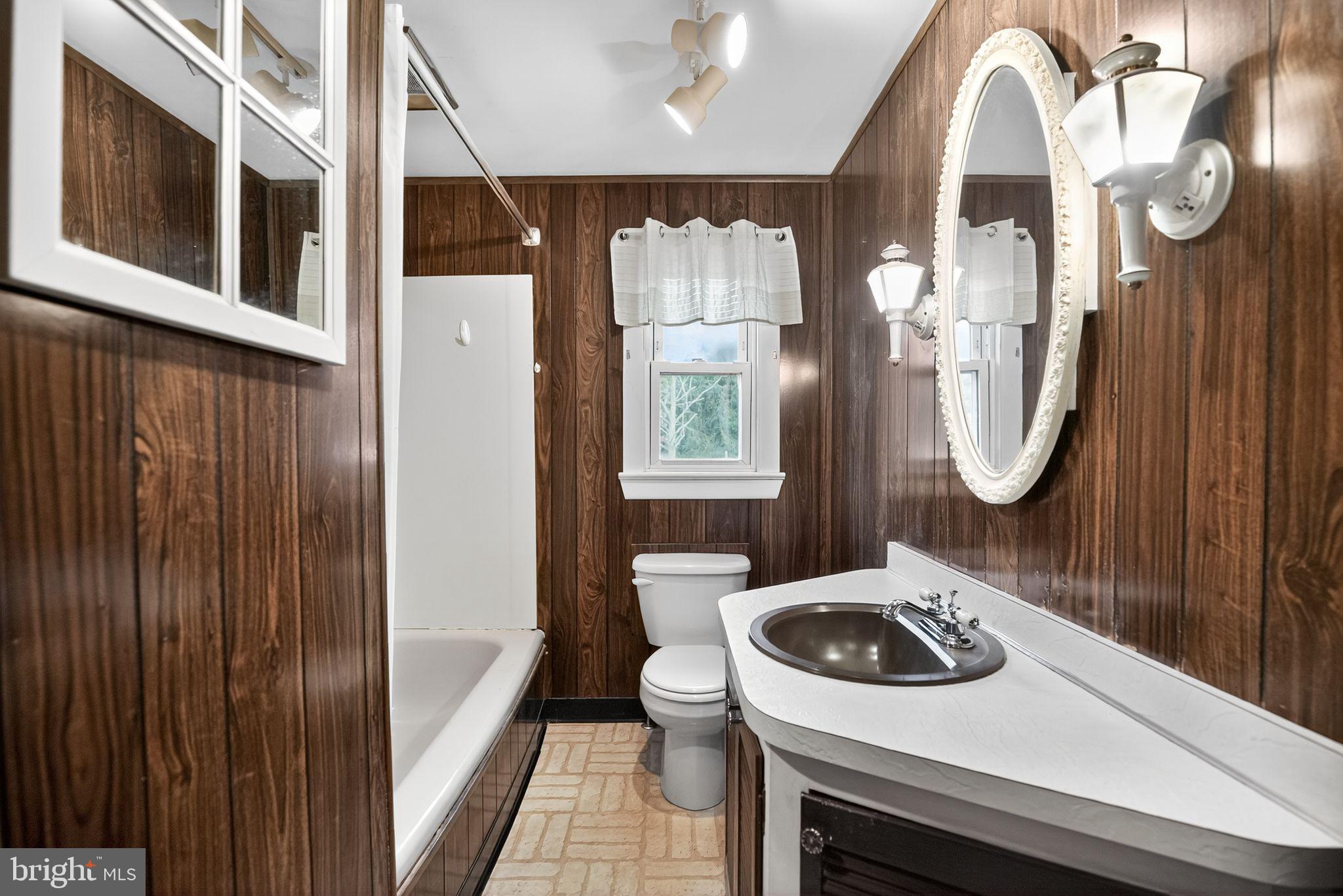 420 North Lewis Road Royersford, PA 19468 - Photo 21 of 28 a bathroom with a toilet a sink and mirror