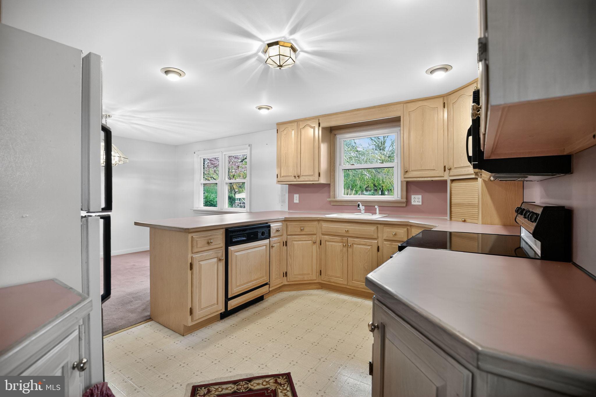 420 North Lewis Road Royersford, PA 19468 - Photo 8 of 28 a kitchen with a sink appliances cabinets and a window
