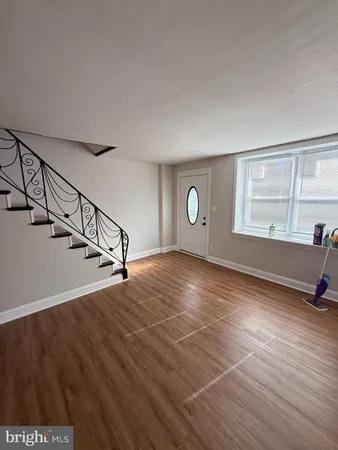 a view of a room with gym equipment and a window