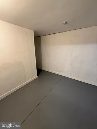 an empty room with a bench