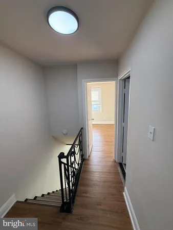 a view of entryway with wooden floor