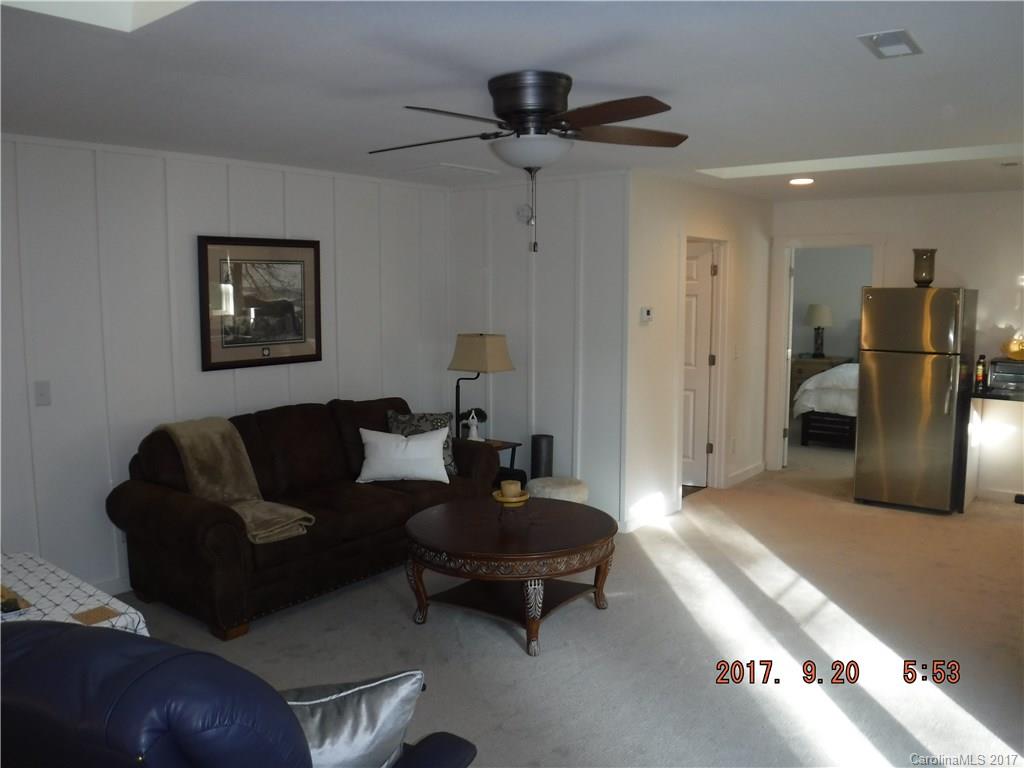 535 Sloping Meadow Mill Spring, NC 28756 - Photo 22 of 24 a living room with furniture and a rug