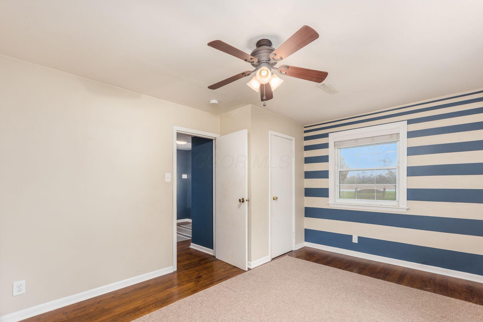 9221 London Road Orient, OH 43146 - Photo 10 of 51 First Floor Bedroom/Office with large window and overhead fan measuring 10'9" x 14'9"