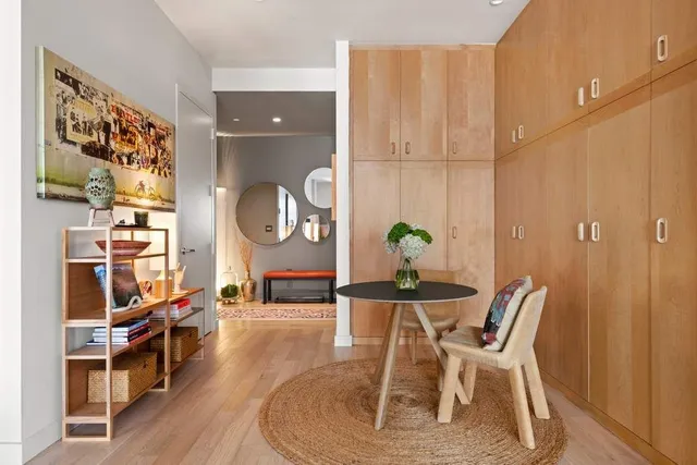 a living room with furniture and a lamp
