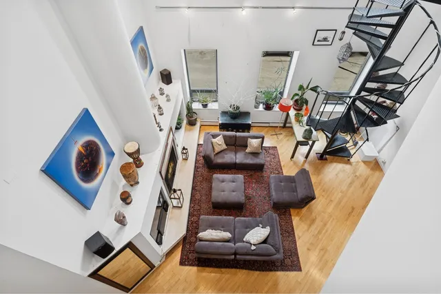 a view of living room with furniture and gym equipment