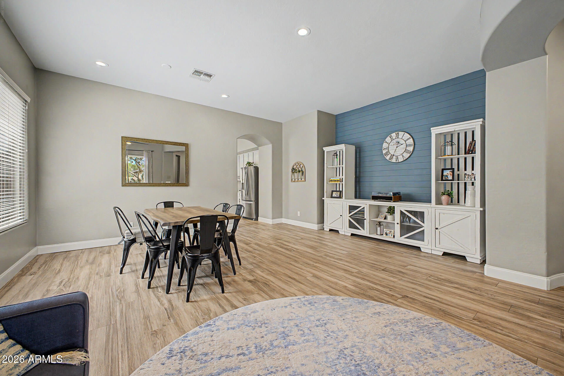 4272 East Buckboard Road Gilbert, AZ 85297 - Photo 10 of 37 a view of a dining room with furniture and wooden floor