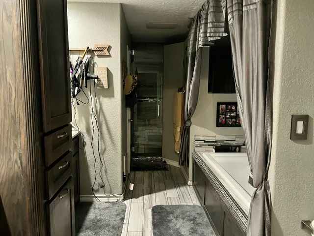 a kitchen with a refrigerator and a stove