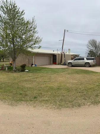 a view of a patio with a yard