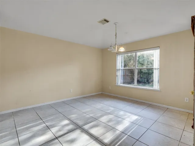 a view of an empty room with windows