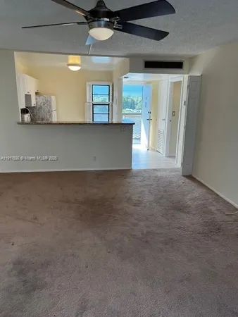 a dinning room with a table and chairs