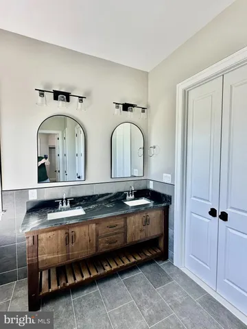 a bathroom with a bathtub and a sink