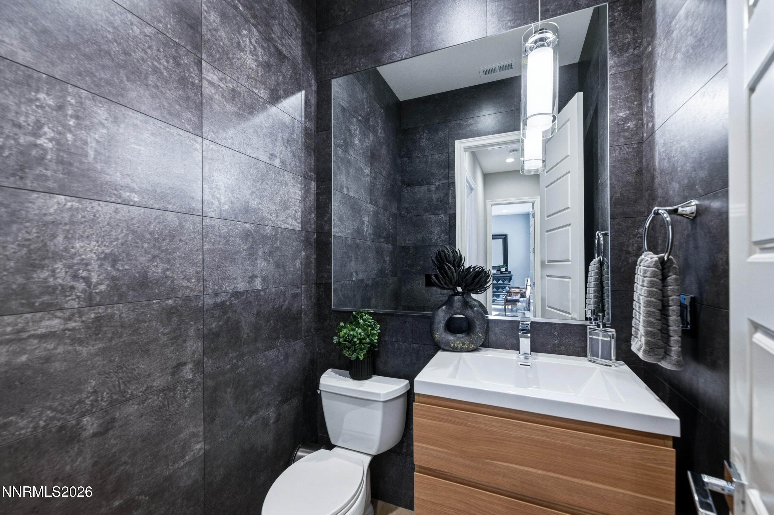 9028 Iron Sky Court Reno, NV 89523 - Photo 18 of 36 a bathroom with a sink and a toilet