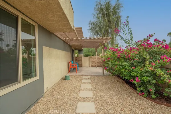 a view of a pathway with a house