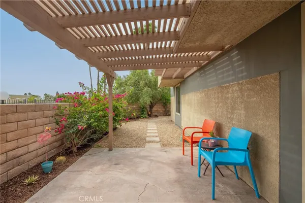 a view of a chairs in patio