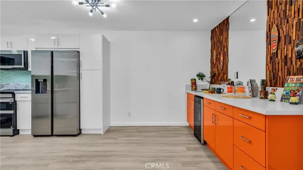 a kitchen with stainless steel appliances a refrigerator and a sink