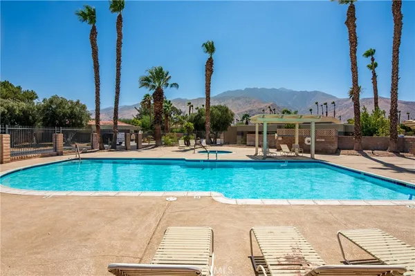 a view of a swimming pool with a patio