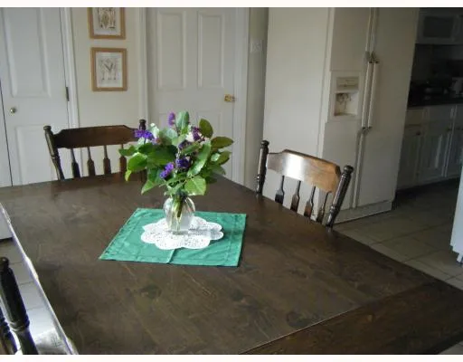 a view of kitchen with furniture and wooden floor