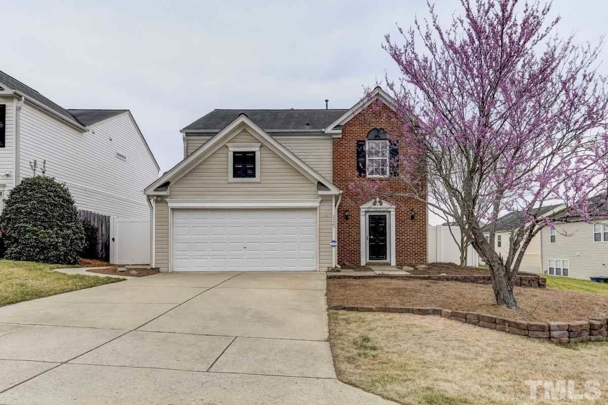 3323 Marcony Way Raleigh, NC 27610 - Photo 1 of 14 a front view of a house with a yard and garage