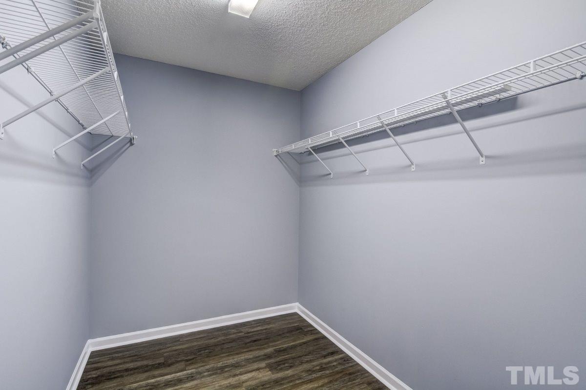 3323 Marcony Way Raleigh, NC 27610 - Photo 9 of 14 a view of a room with racks on the wall
