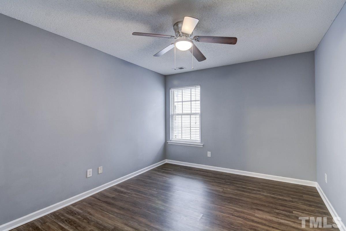 3323 Marcony Way Raleigh, NC 27610 - Photo 10 of 14 wooden floor in an empty room with a window