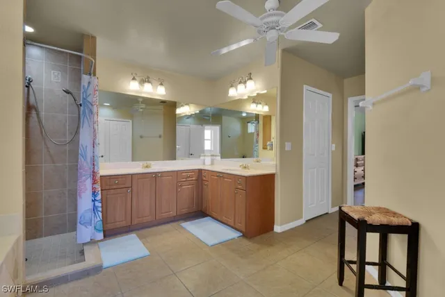 a large bathroom with a mirror and a shower
