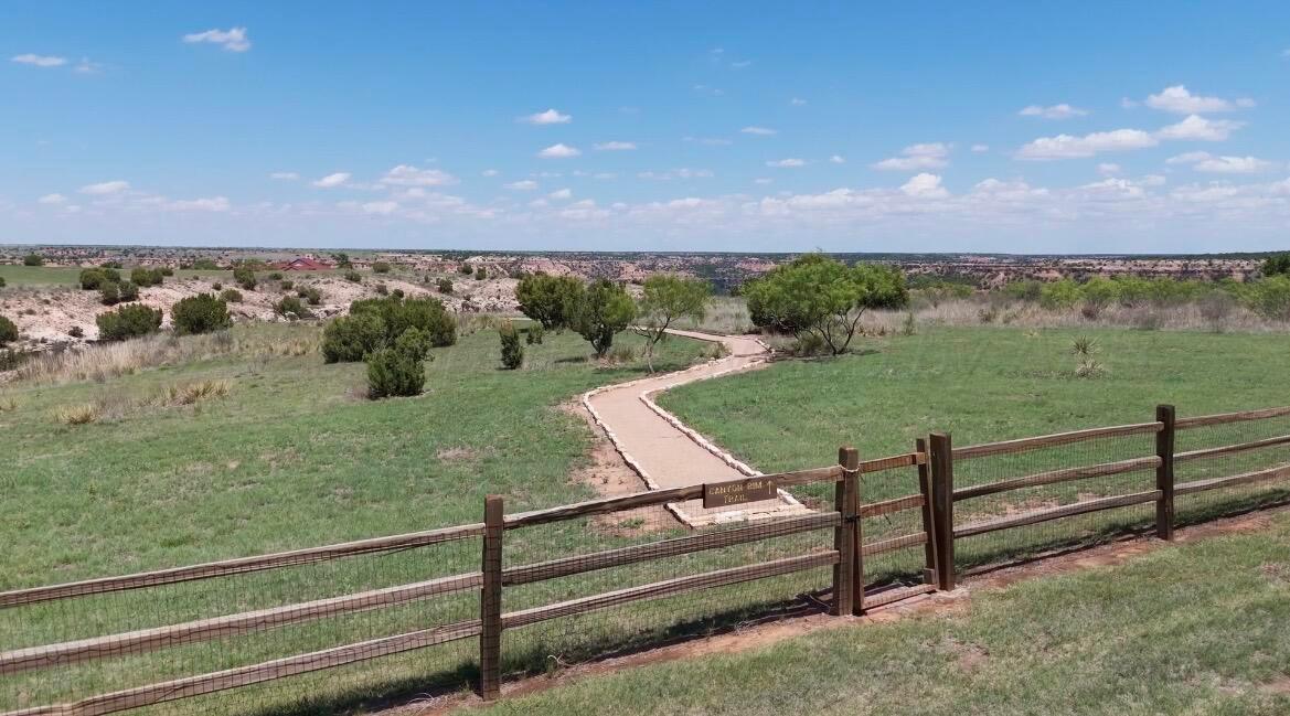 7701 Canyon Bend Road Amarillo, TX 79118 - Photo 10 of 72 a view of a wooden deck and city view