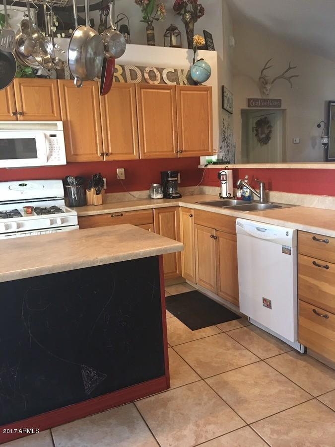 5735 Debbie Lane Rimrock, AZ 86335 - Photo 14 of 23 a kitchen with a sink and cabinets