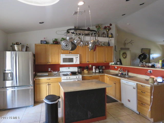 5735 Debbie Lane Rimrock, AZ 86335 - Photo 3 of 23 a kitchen with a sink a stove and cabinets