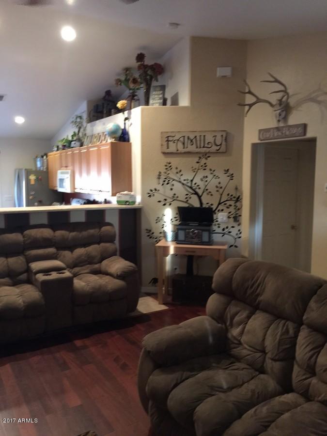 5735 Debbie Lane Rimrock, AZ 86335 - Photo 5 of 23 a living room with furniture and a fireplace