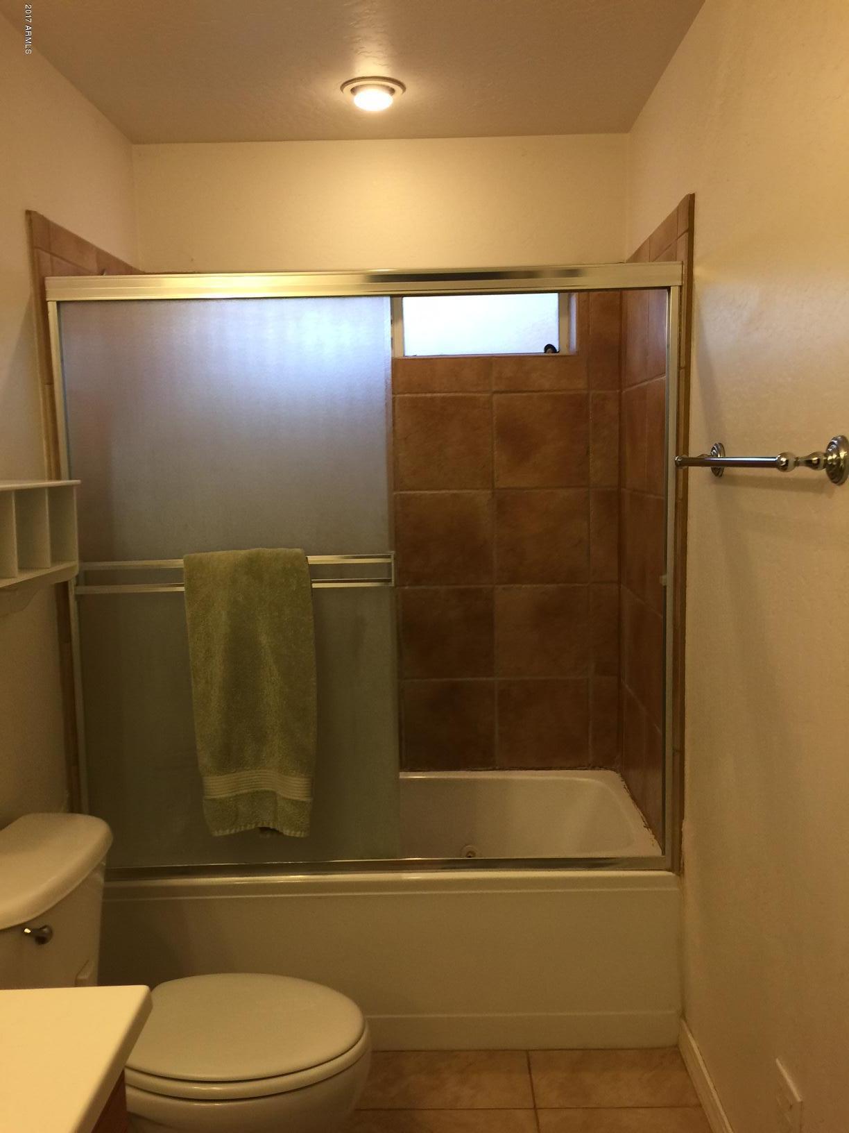 5735 Debbie Lane Rimrock, AZ 86335 - Photo 8 of 23 a bathroom with a toilet and a shower