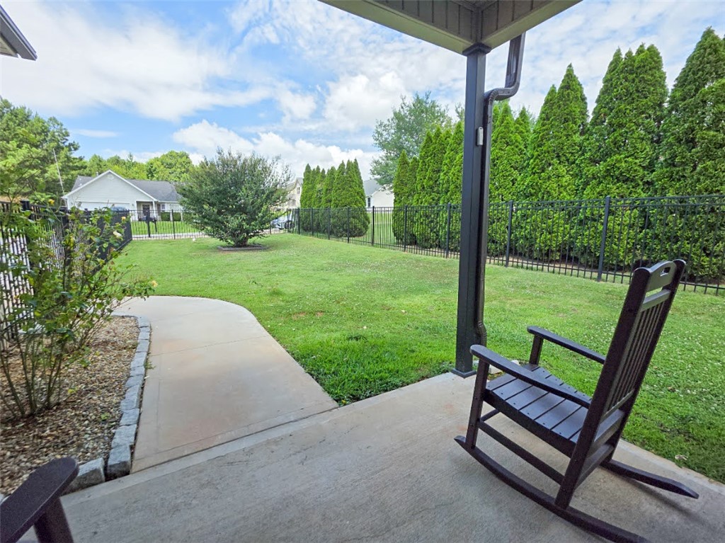 3 Cringle Lane Anderson, SC 29625 - Photo 23 of 26 Relax on the covered patio, gazing at the private yard bordered by a sturdy fence and mature trees.