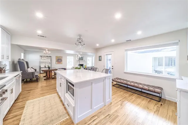a spacious bathroom with a double vanity sink and a large mirror