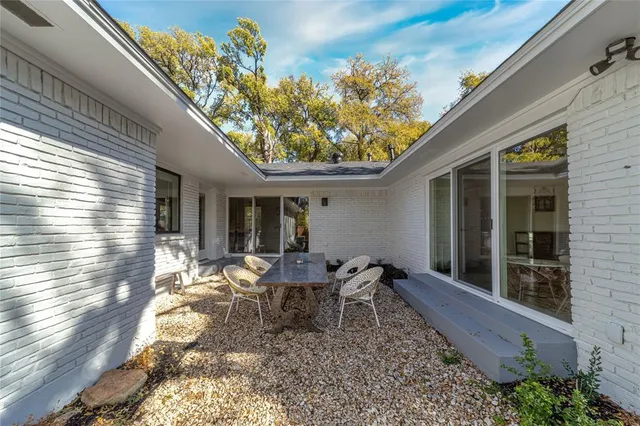 a house view with sitting space and garden space