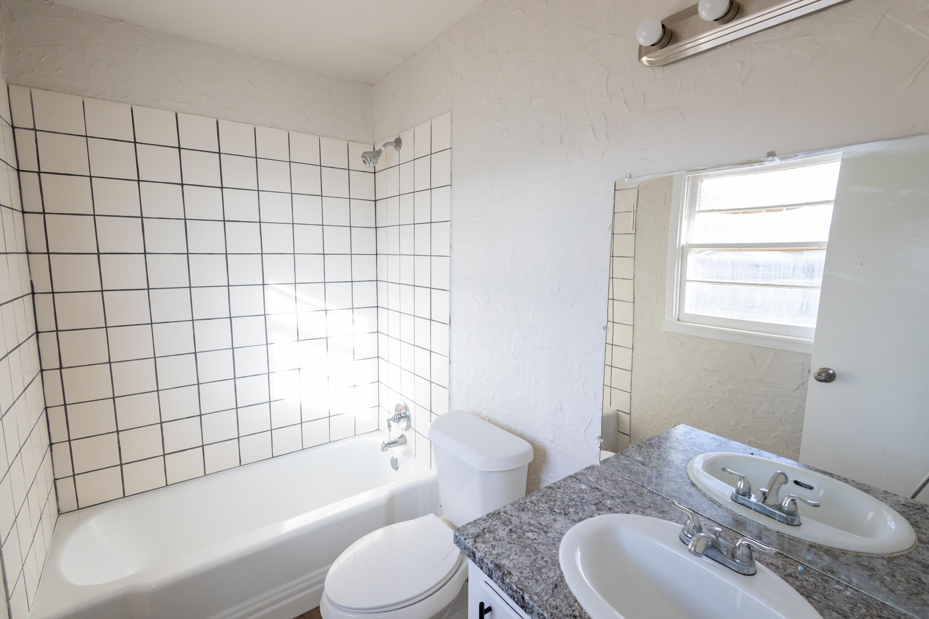 606 Bangor Avenue Lubbock, TX 79416 - Photo 15 of 26 a bathroom with a sink toilet and shower