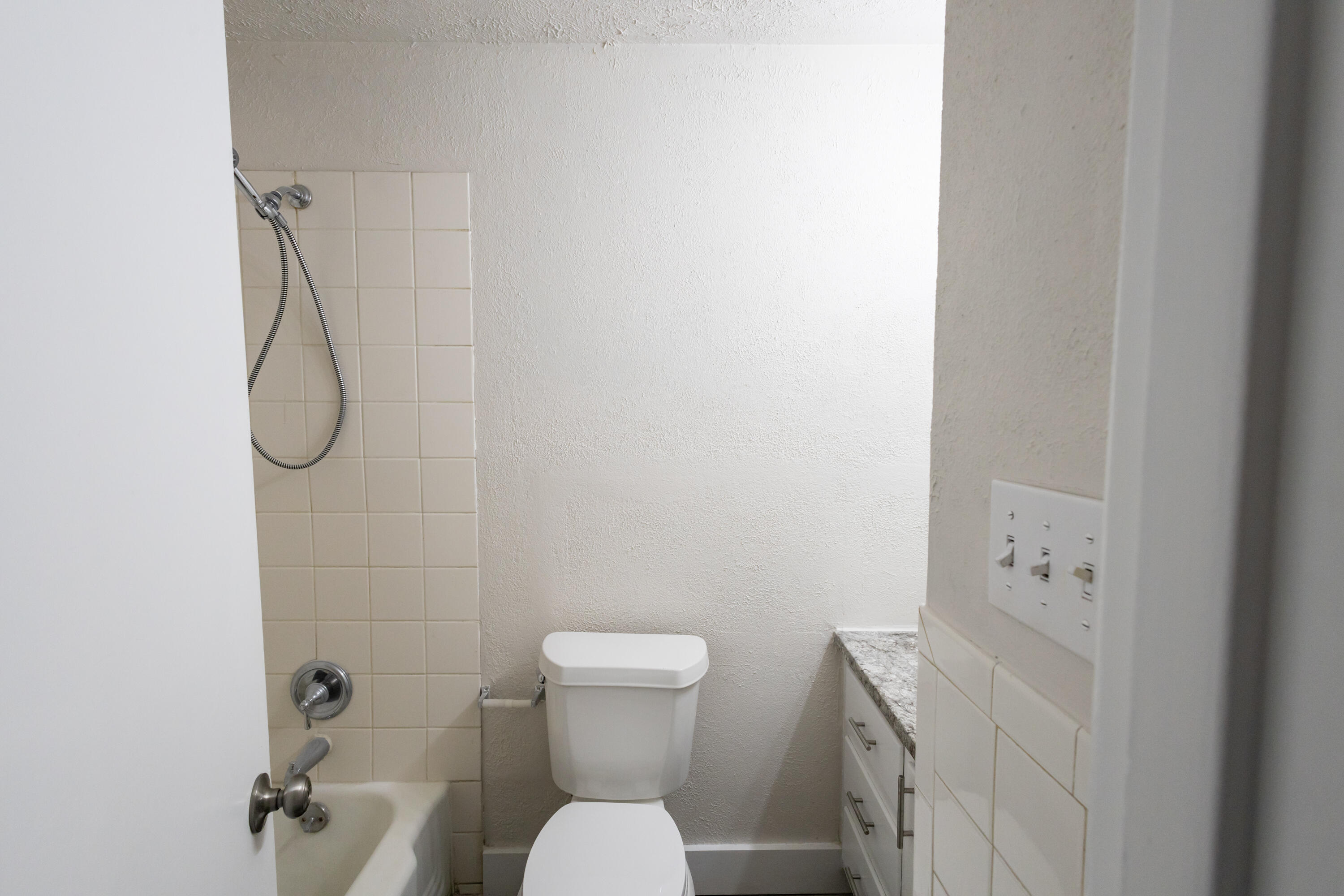 606 Bangor Avenue Lubbock, TX 79416 - Photo 19 of 26 a bathroom with a toilet and a shower
