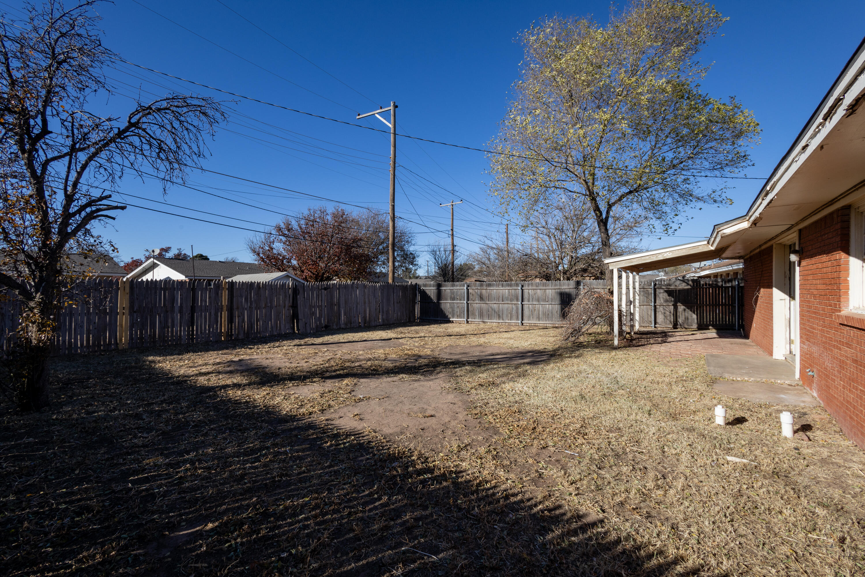 606 Bangor Avenue Lubbock, TX 79416 - Photo 24 of 26 a view of a yard with wooden fence