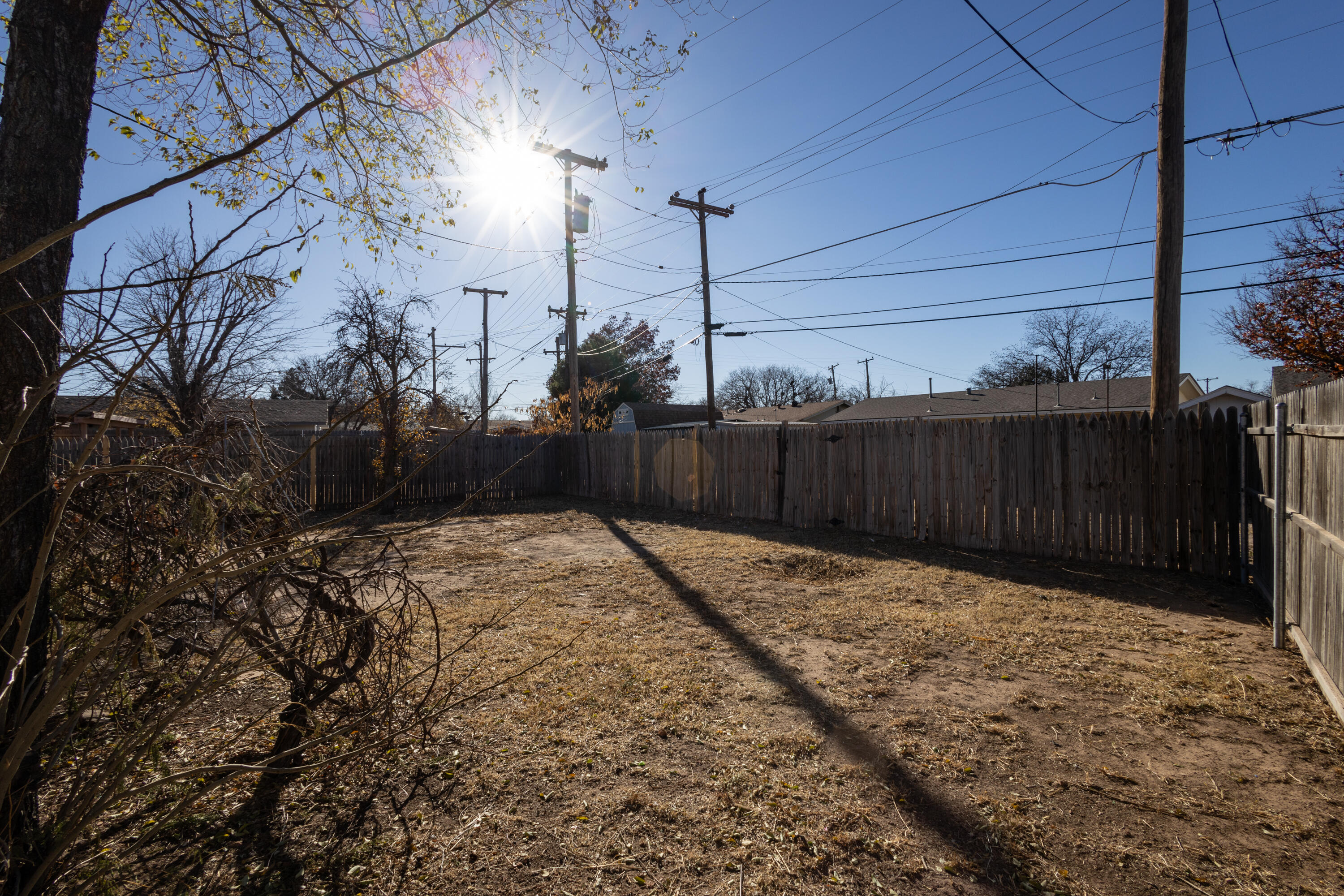 606 Bangor Avenue Lubbock, TX 79416 - Photo 25 of 26 a view of backyard with wooden fence