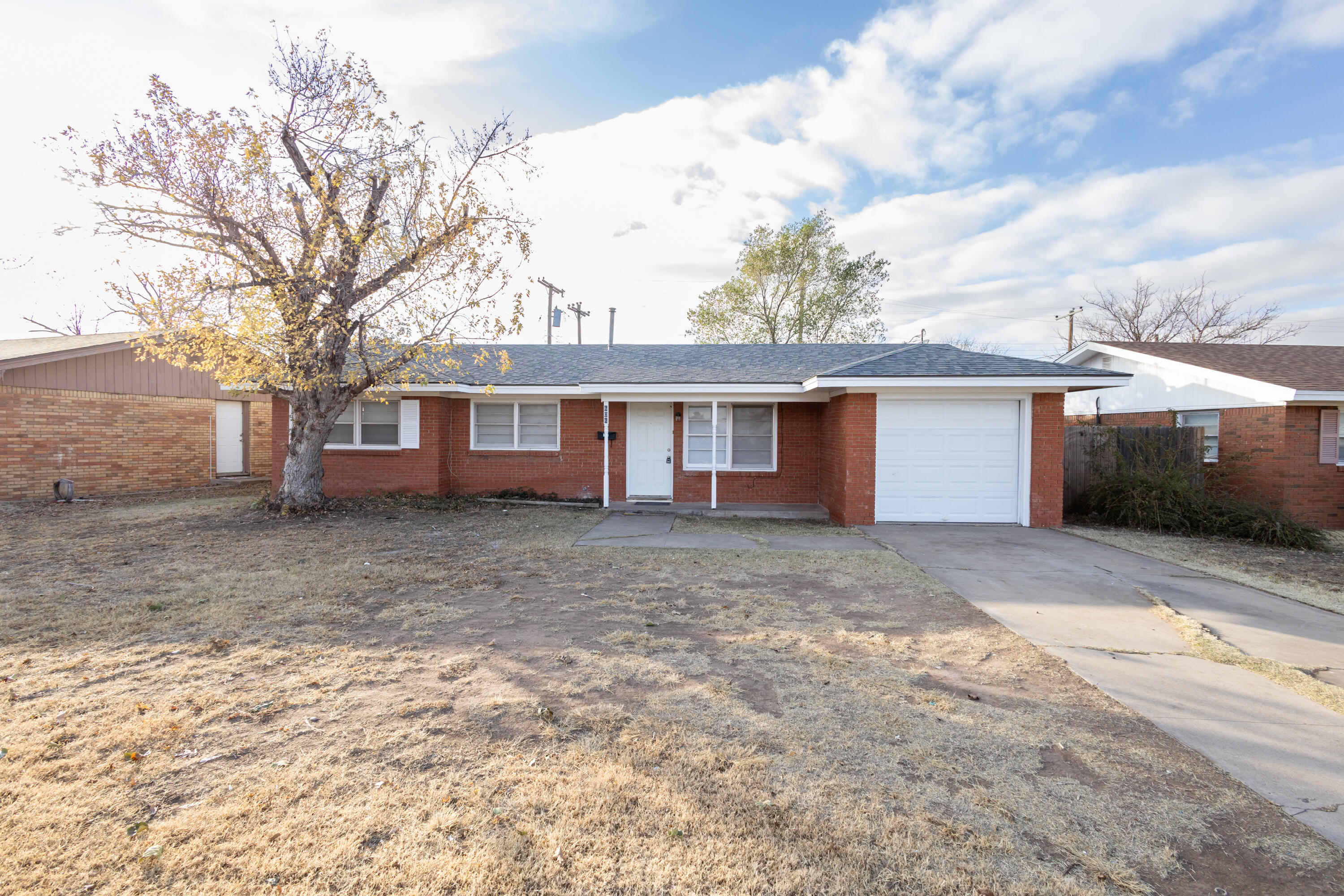 606 Bangor Avenue Lubbock, TX 79416 - Photo 26 of 26 front view of a house with a yard