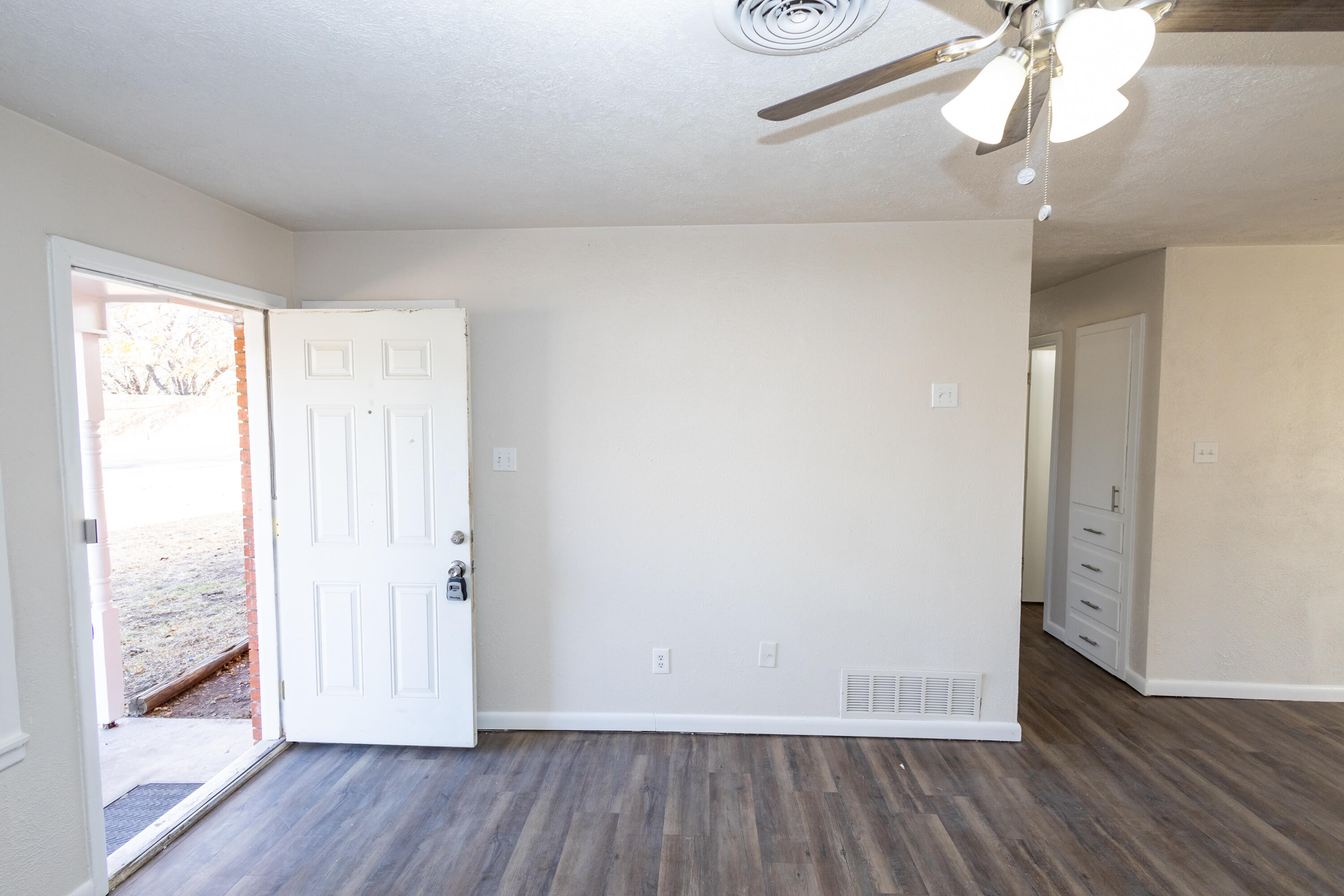 606 Bangor Avenue Lubbock, TX 79416 - Photo 8 of 26 a view of a room with wooden floor and closet